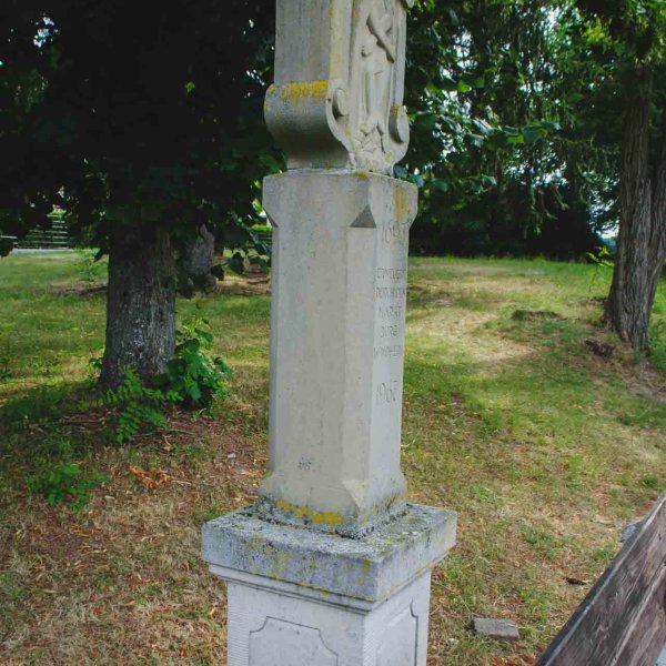 Side of the wayside shrine with baroque-style coffered pedestal block